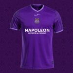 Front view of a purple soccer jersey with a club crest, stars, and a Napoleon Sports & Casino sponsor logo on the chest for branding context.