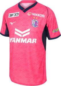 ua8t4OJROcVYKub | UAE SPORT STORE Pink soccer jersey with navy trim and geometric pattern, team crest on chest, YANMAR sponsor across front, Mizuno logo nearby, and NIKKON sponsor above.