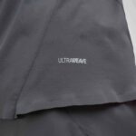 Close-up of dark gray, textured fabric with the word 'ULTRAWAVE' printed on it.