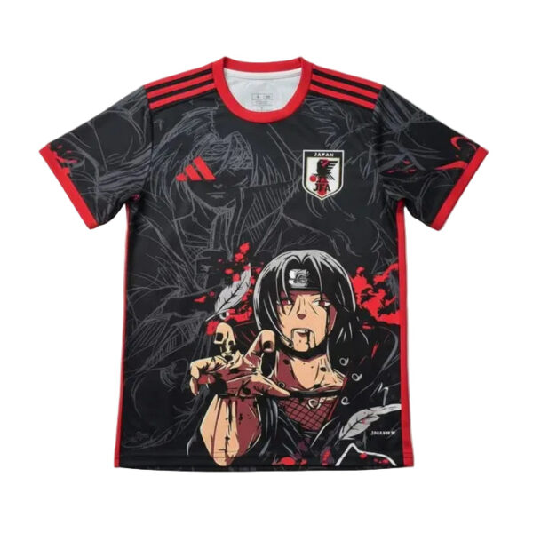 Black Japan soccer jersey with red trim and an anime character reaching forward across the front; national crest on the chest.