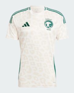 White Saudi football jersey with green SAFF crest on the chest and Adidas shoulder stripes, front view