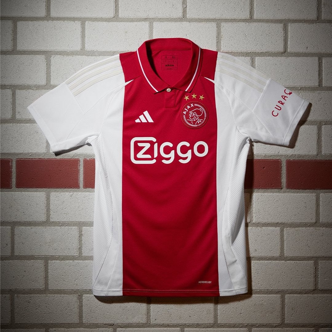 wDLpwY48Es8svzp | UAE SPORT STORE Ajax soccer jersey: red central panel with white sides, featuring Ziggo sponsor and Ajax crest with stars on the chest (Adidas).