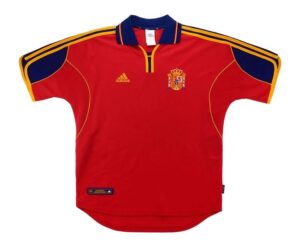 Red Spain national team polo jersey with blue and yellow accents, crest, and Adidas logo on the chest.