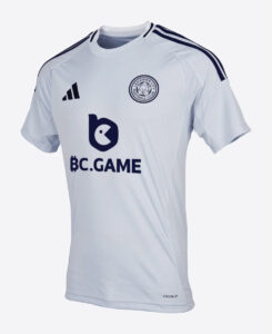 White Leicester City FC football shirt with navy shoulder stripes, club crest on the left chest, and a large BC.GAME sponsor logo on the front.