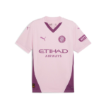 Pink football jersey with purple side panels, featuring Etihad Airways sponsor, Puma logos, and a round team crest on the left chest.