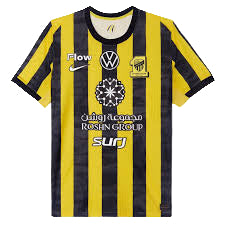 Soccer jersey with vertical yellow and black stripes, club crest on the left chest, and sponsor logos across the front.