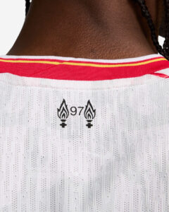 Close-up of the back of a white jersey with a red collar, showing two flame logos and the number 97 between them.