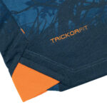 y2 | UAE SPORT STORE Close-up of dark navy fabric with orange stitching and the brand name TRICKOFIT in orange.