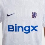 White Chelsea FC jersey with blue Nike swoosh on the left, club crest on the right, and a blue BingX sponsor logo across the chest.