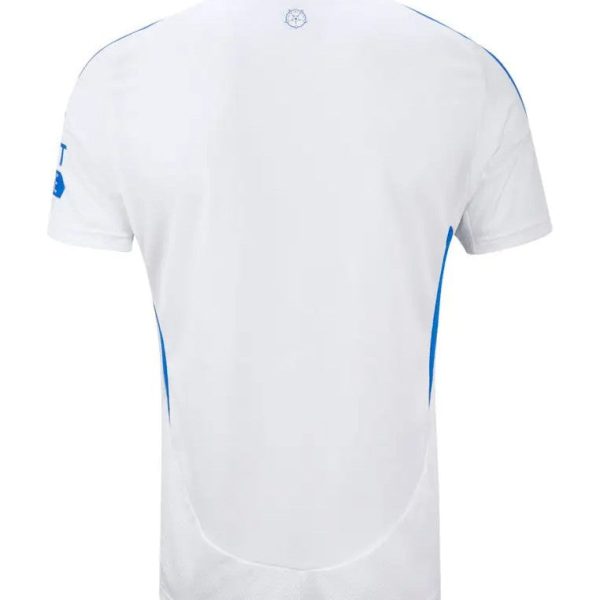 White short-sleeve sports jersey shown from the back with blue piping and a small crest at the upper center back.