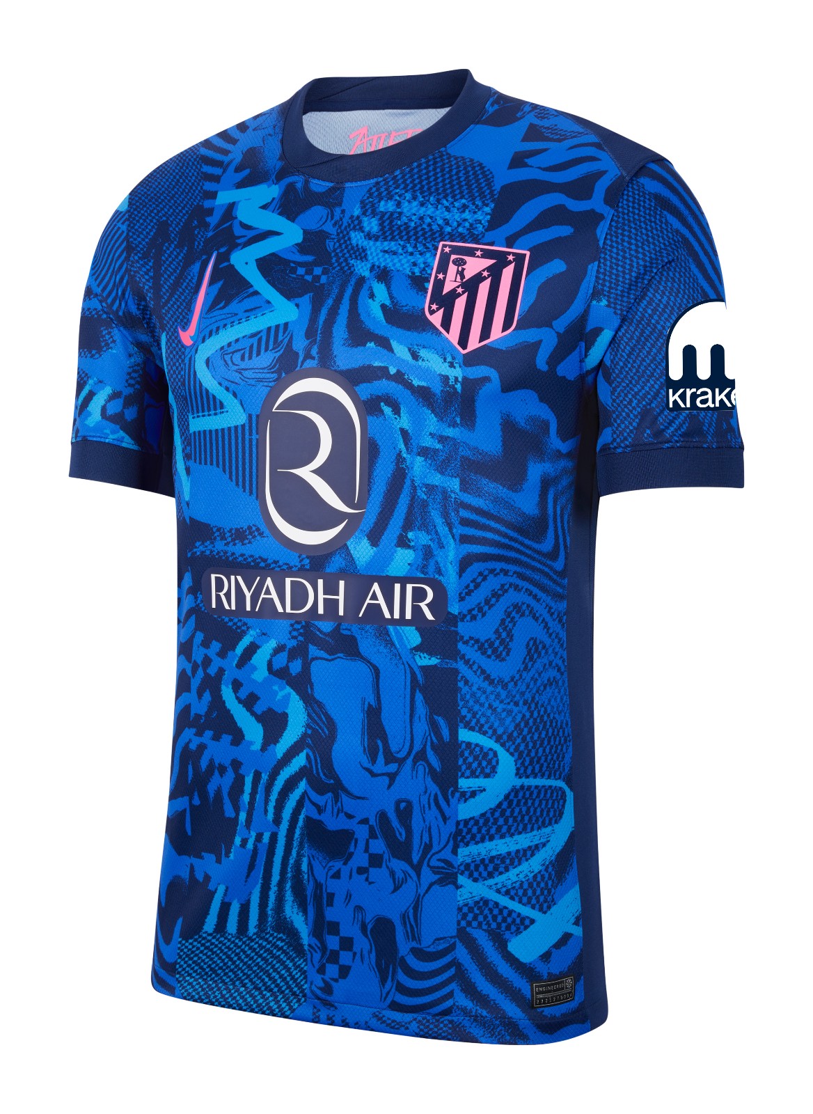 zfV1s9ExdAqQlMp | UAE SPORT STORE Blue patterned soccer jersey with Riyadh Air sponsor across the chest, pink Atlético Madrid crest, and a white Kraken logo on the sleeve.