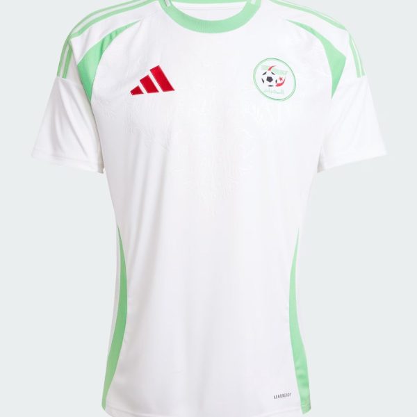 White soccer jersey with green accents, red Adidas logo, and circular crest on the chest showing a soccer ball motif.