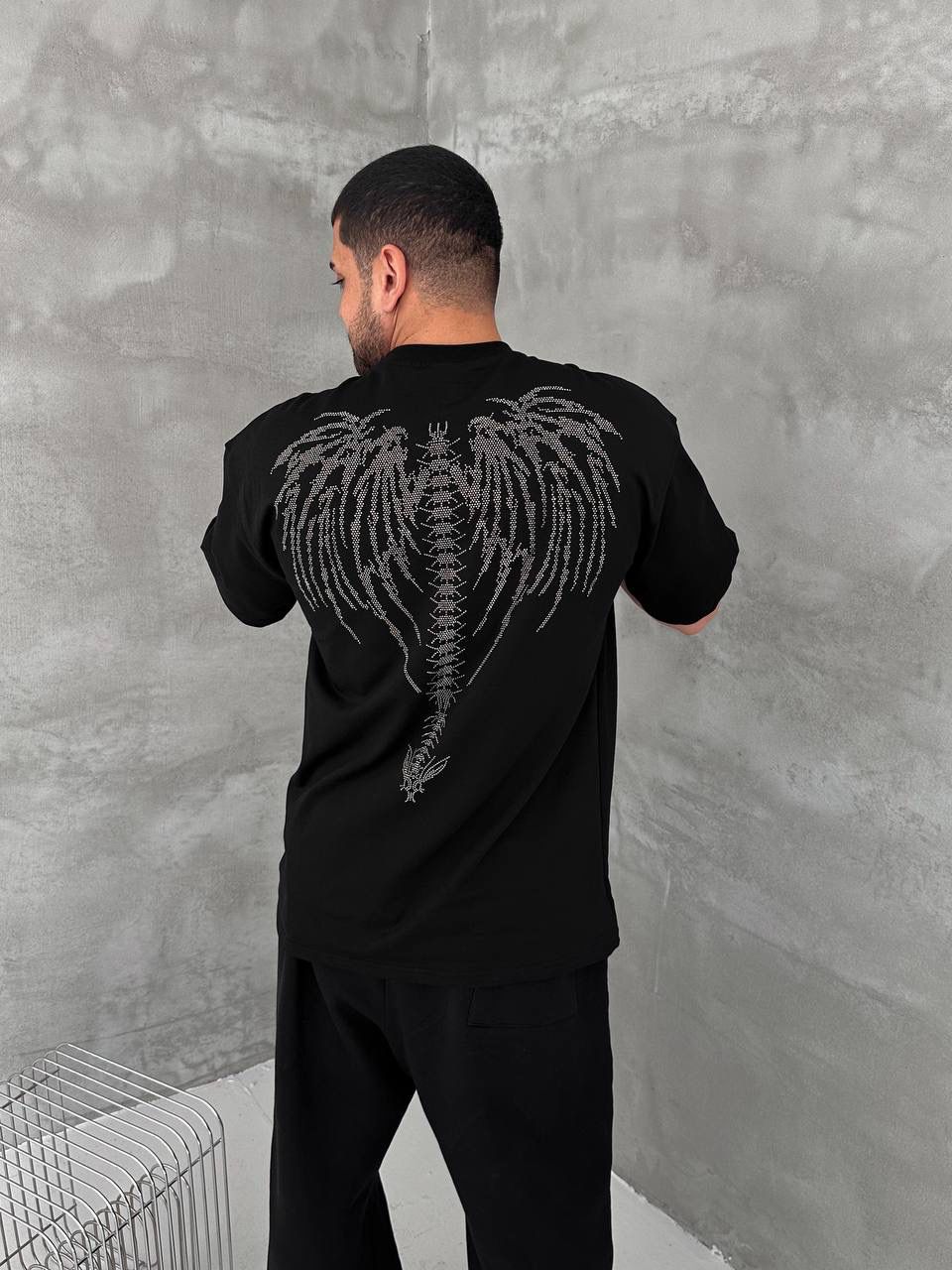 04356925-9b2c-4f83-8c3f-daa2c364d31a | UAE SPORT STORE Men’s Black Oversized Dark Angel Rhinestone T-Shirt