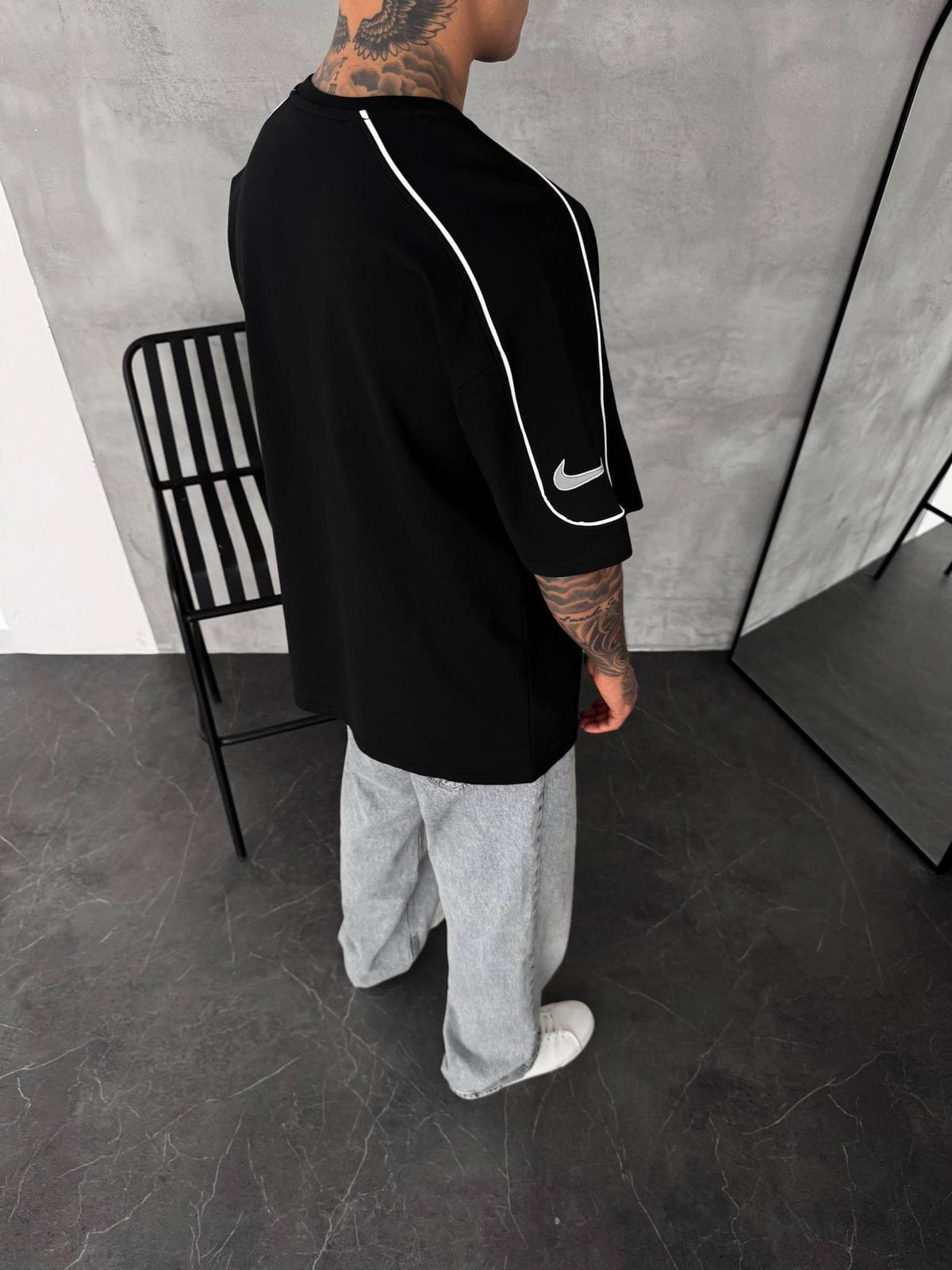 7f0c9d91-ac0d-442e-8149-35f2359e501a | UAE SPORT STORE Men’s Oversized Black T-Shirt with White Piping