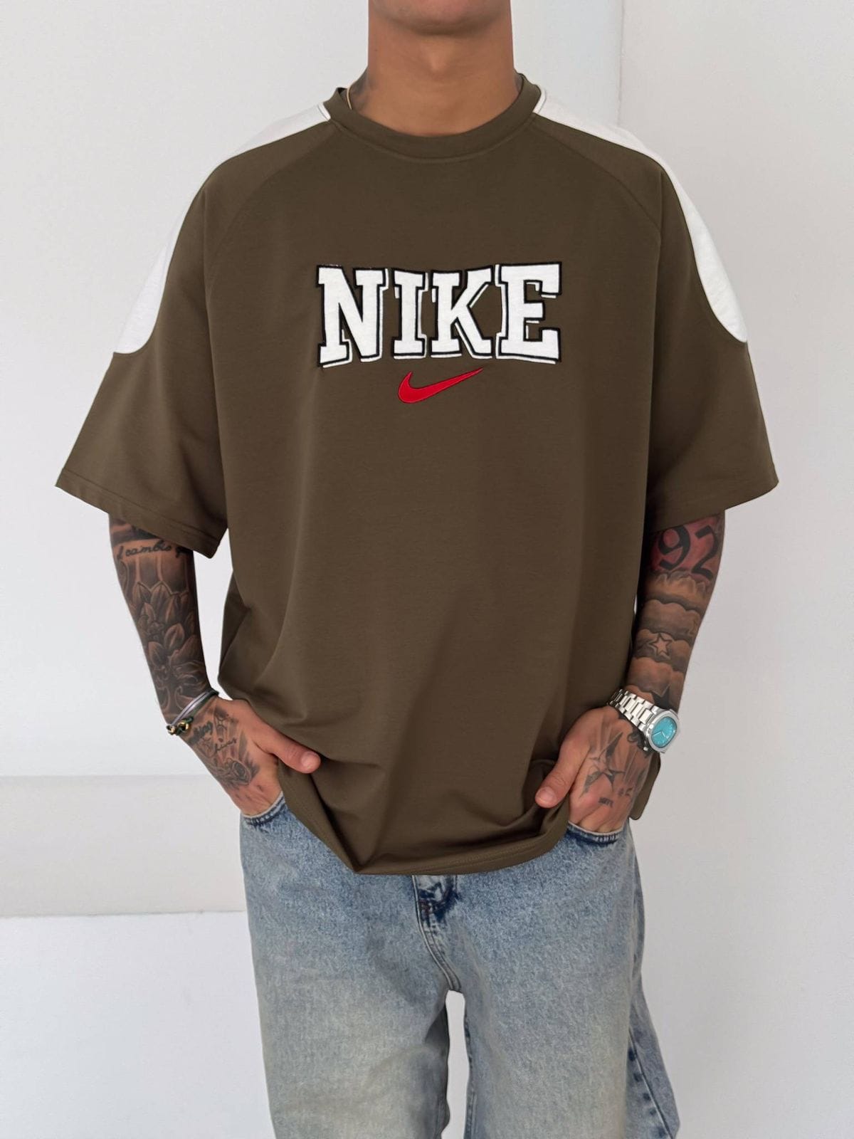 9ea1d3e4-e40d-400f-aca1-826fb5a45fbc | UAE SPORT STORE Men’s Oversized Olive Graphic T-Shirt with White Shoulder Panels