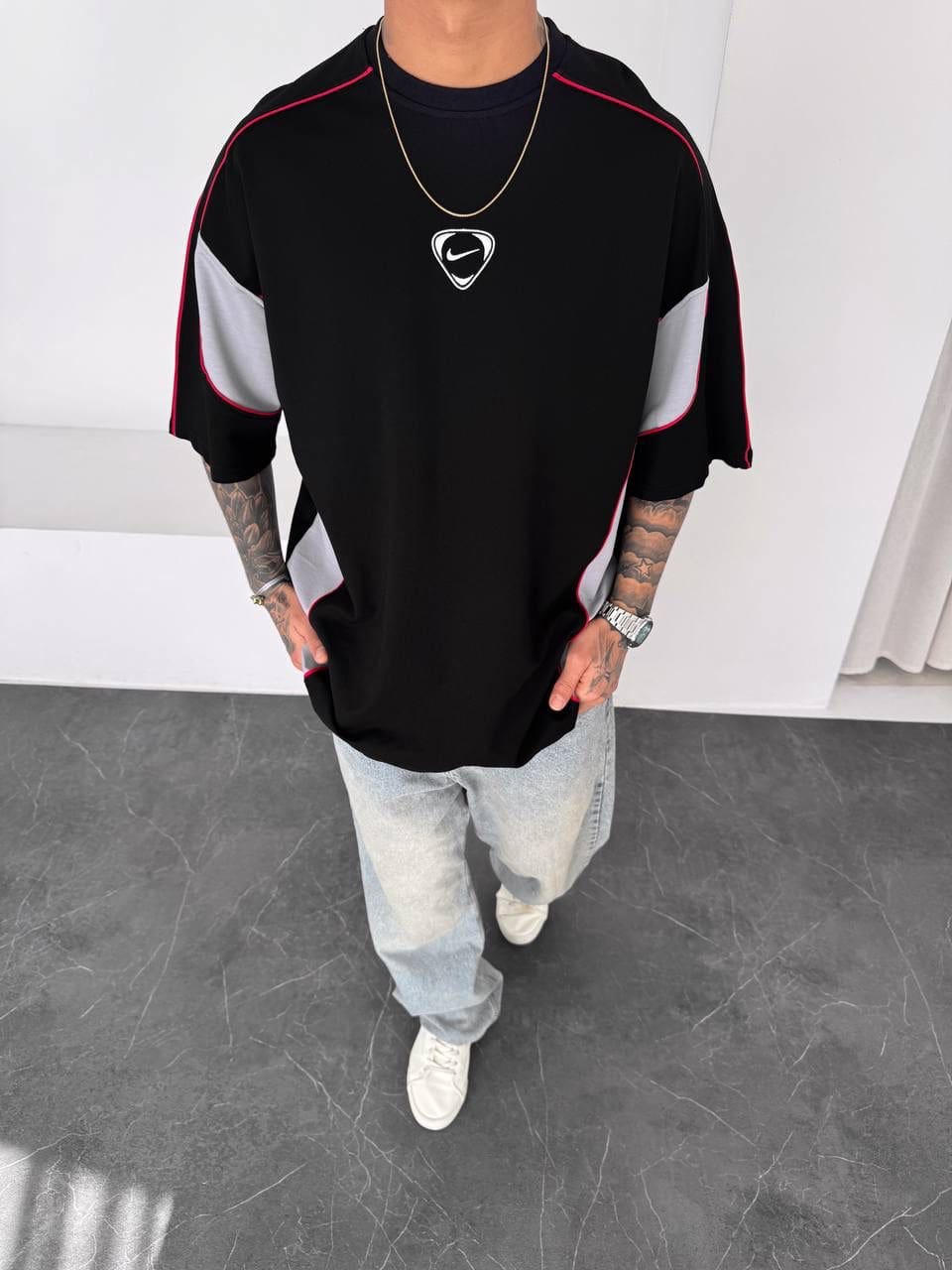 a2fd44c9-bc33-4b54-b899-09c0cf8daea7 | UAE SPORT STORE Men’s Oversized Black T-Shirt with Grey Panels and Red Piping
