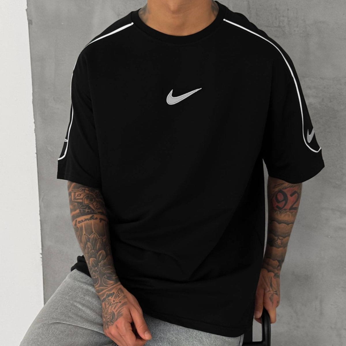 c81f9c84-876a-4193-b306-70f1556e90bd | UAE SPORT STORE Men’s Oversized Black T-Shirt with White Piping