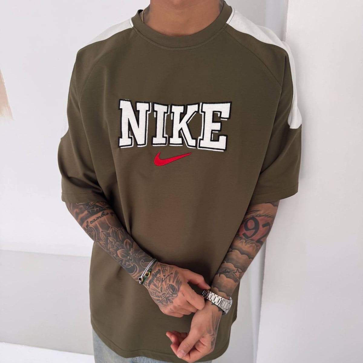 e938828a-1dd5-4a66-b844-ab30e267a6e7 | UAE SPORT STORE Men’s Oversized Olive Graphic T-Shirt with White Shoulder Panels