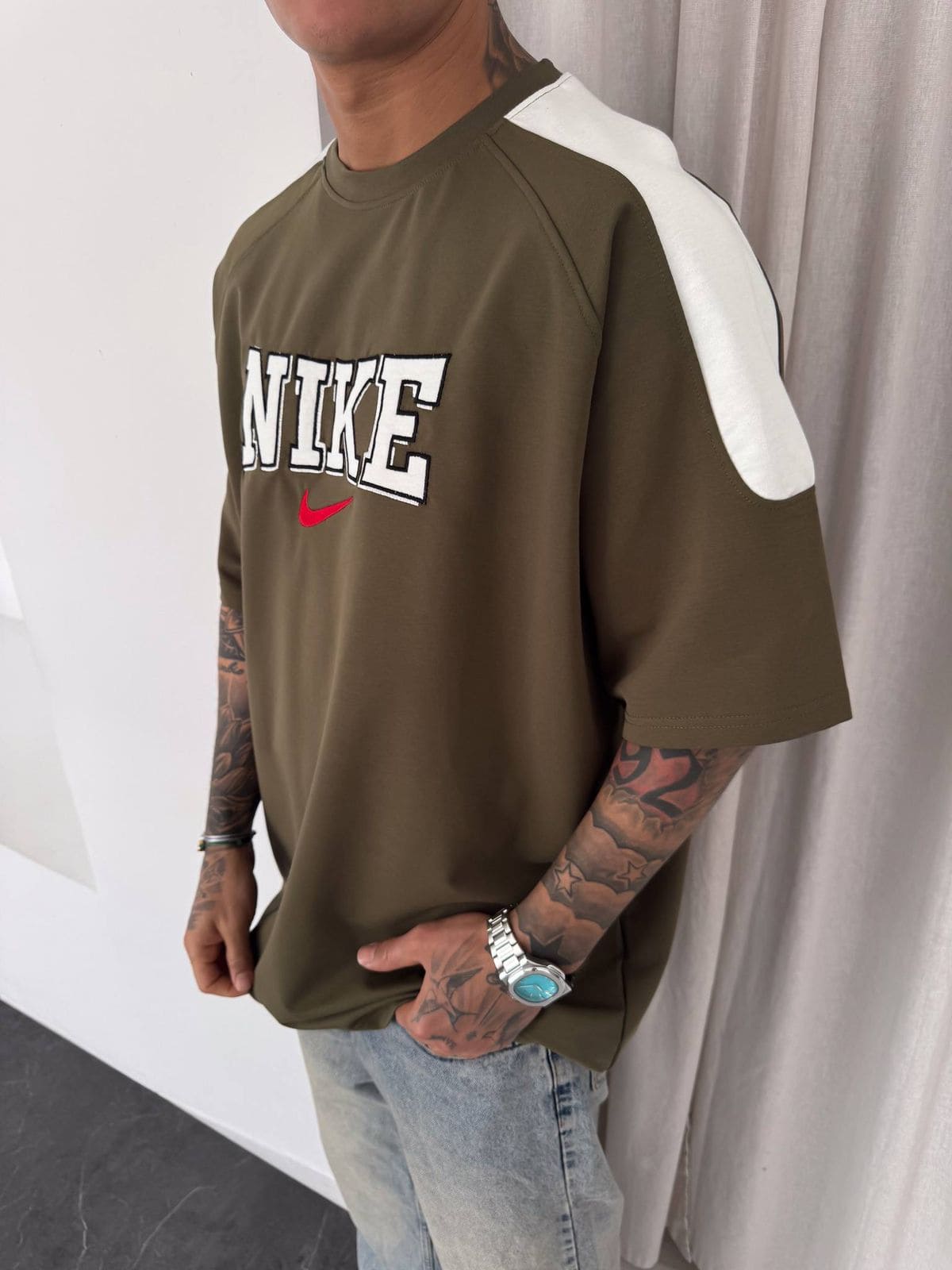 f9486672-a5e8-4644-a065-eafec0466008 | UAE SPORT STORE Men’s Oversized Olive Graphic T-Shirt with White Shoulder Panels