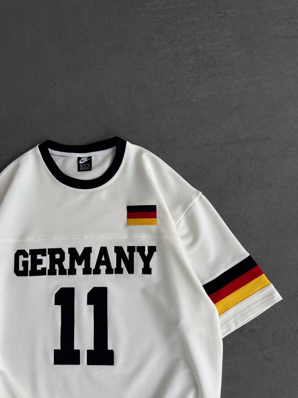 fe69d1ff-187e-4e49-9f29-e4ef7ae2cb55 | UAE SPORT STORE Germany 11 Oversized Jersey Tee – White/Black