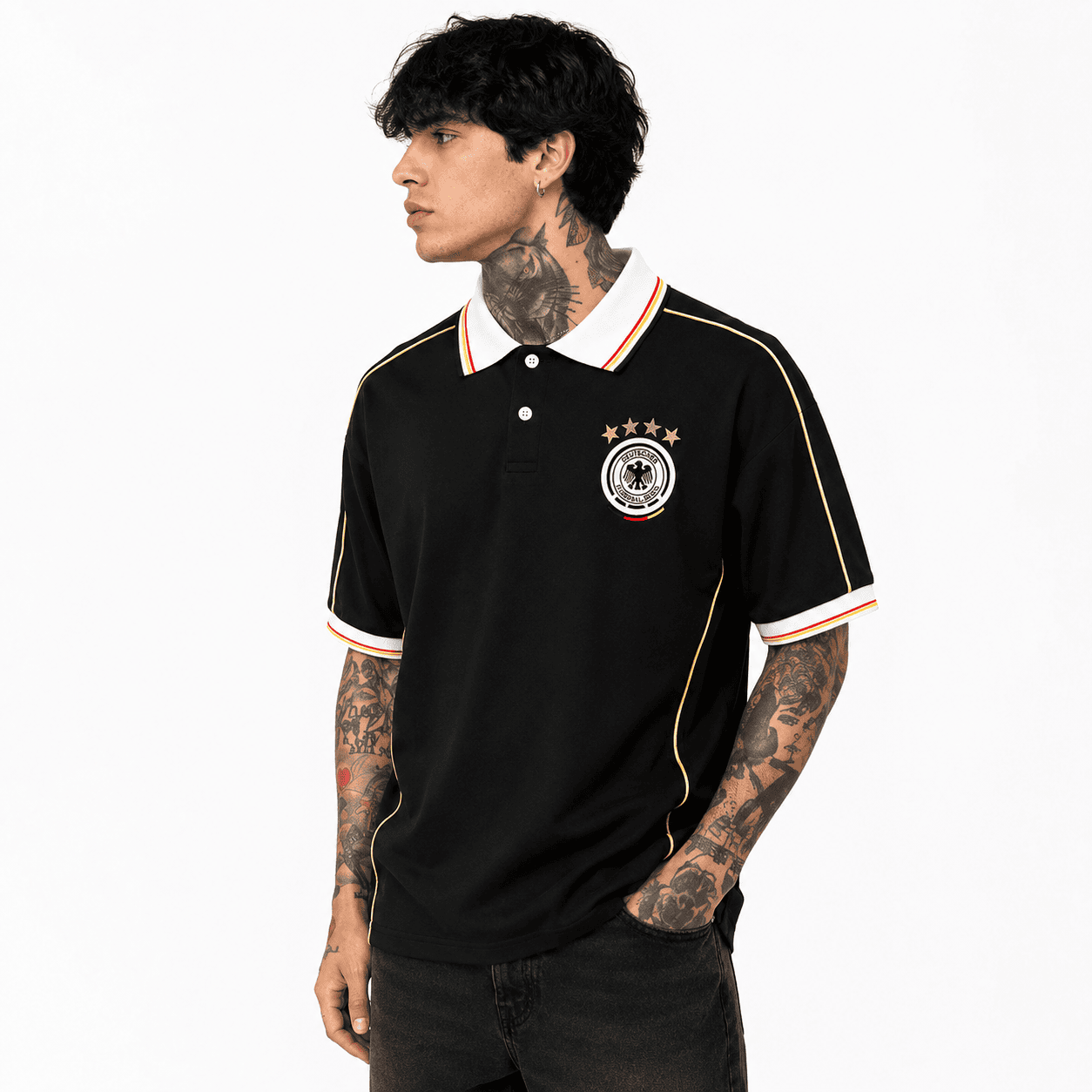 2_eeb4d782-8380-45b7-8dea-95f417da358apng | UAE SPORT STORE Men's Germany retro football polo shirt in black and gold – on model, side view