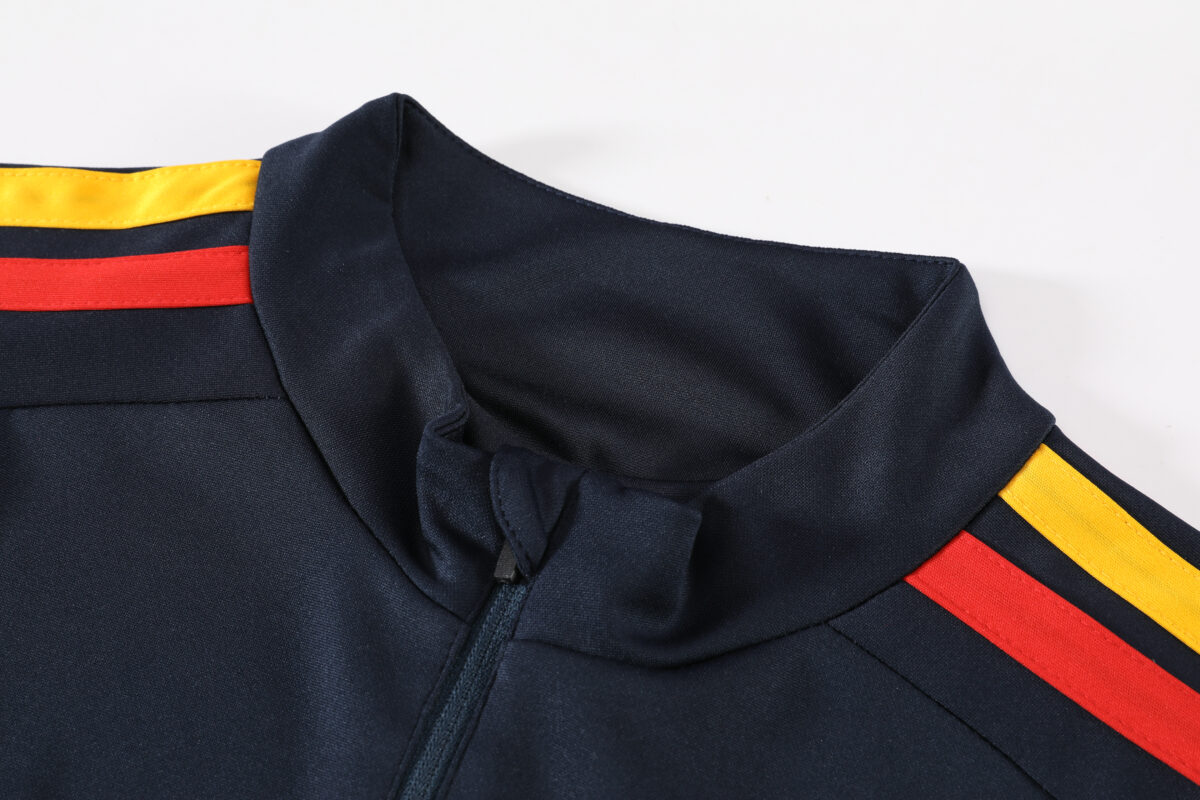 Spain navy training quarter-zip tracksuit collar with red and yellow stripes.