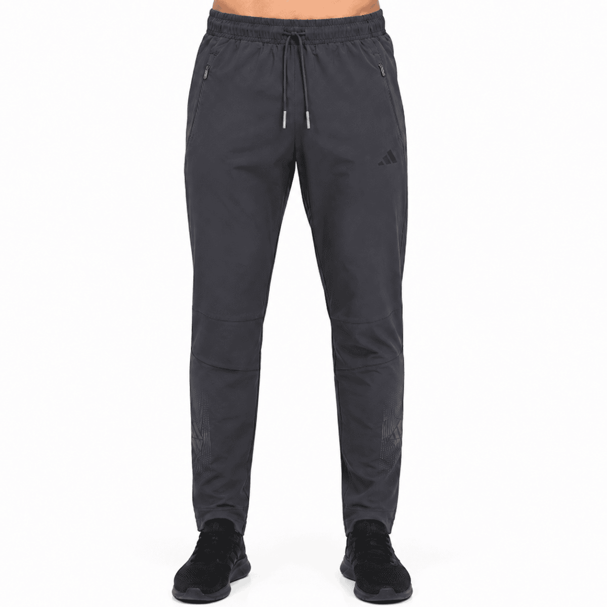 Adidas charcoal black performance training pants with drawstring waist and zip pockets.