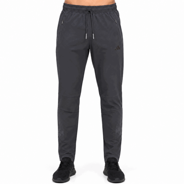 Capture_b7b7f059-eb7b-4ee4-a177-c0505cbfa7d1 - UAE SPORT STORE Adidas charcoal black performance training pants with drawstring waist and zip pockets.