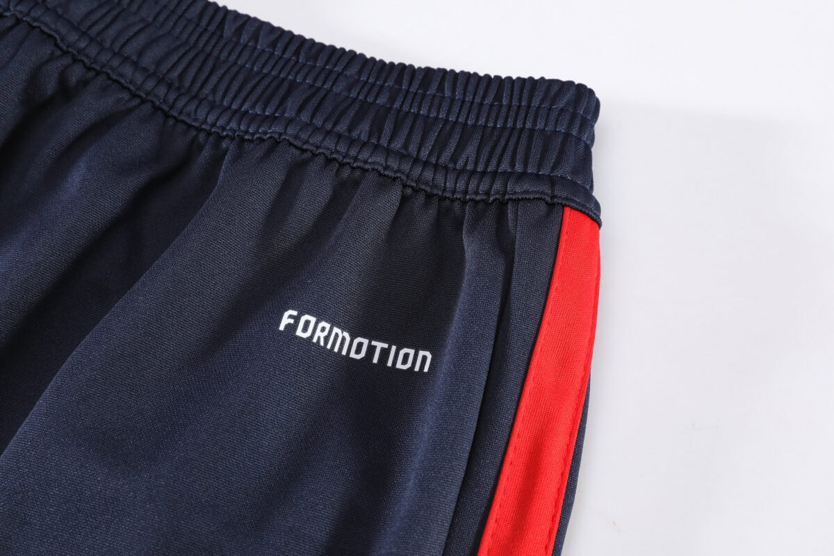 Spain navy training quarter-zip tracksuit with red stripe, 'FORMATION' logo.