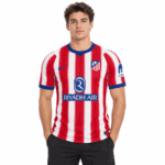 Atlético Madrid home jersey 2026/27 with red and white vertical stripes and club crest.