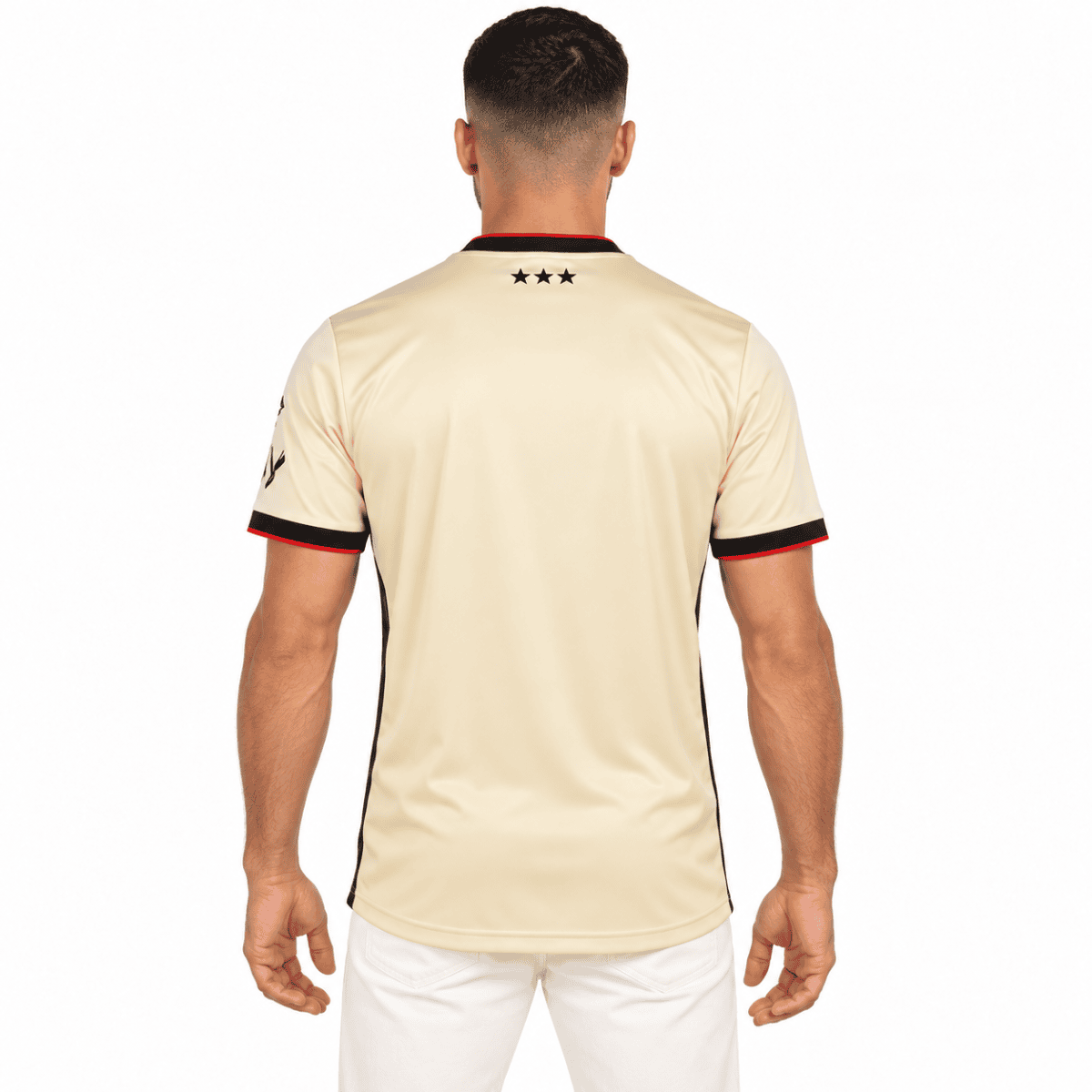 Beige Ipswich Town away jersey with black and red accents, back view.