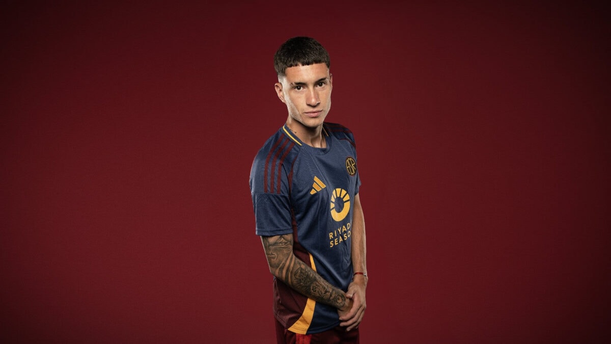 Roma third jersey 2024/25 with dark blue and maroon colors and gold accents.