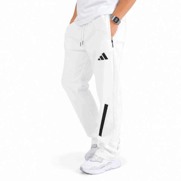 Adidas White Performance Training Pants - UAE SPORT STORE White Adidas training pants with black logo and stripe detail.
