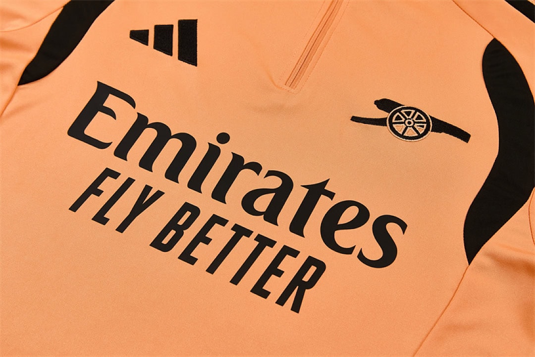 arsenal-orange-training-tracksuit-2027-06 | UAE SPORT STORE Arsenal Orange Training Tracksuit 2027 - front sponsor and cannon detail