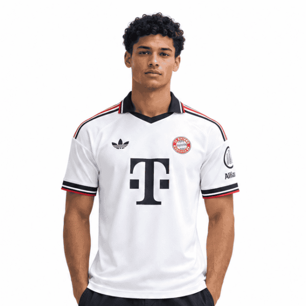 b61593cd-b48f-4e18-8a28-25e38baa3de8 - UAE SPORT STORE Young man in Bayern Munich away football jersey and black cargo pants.