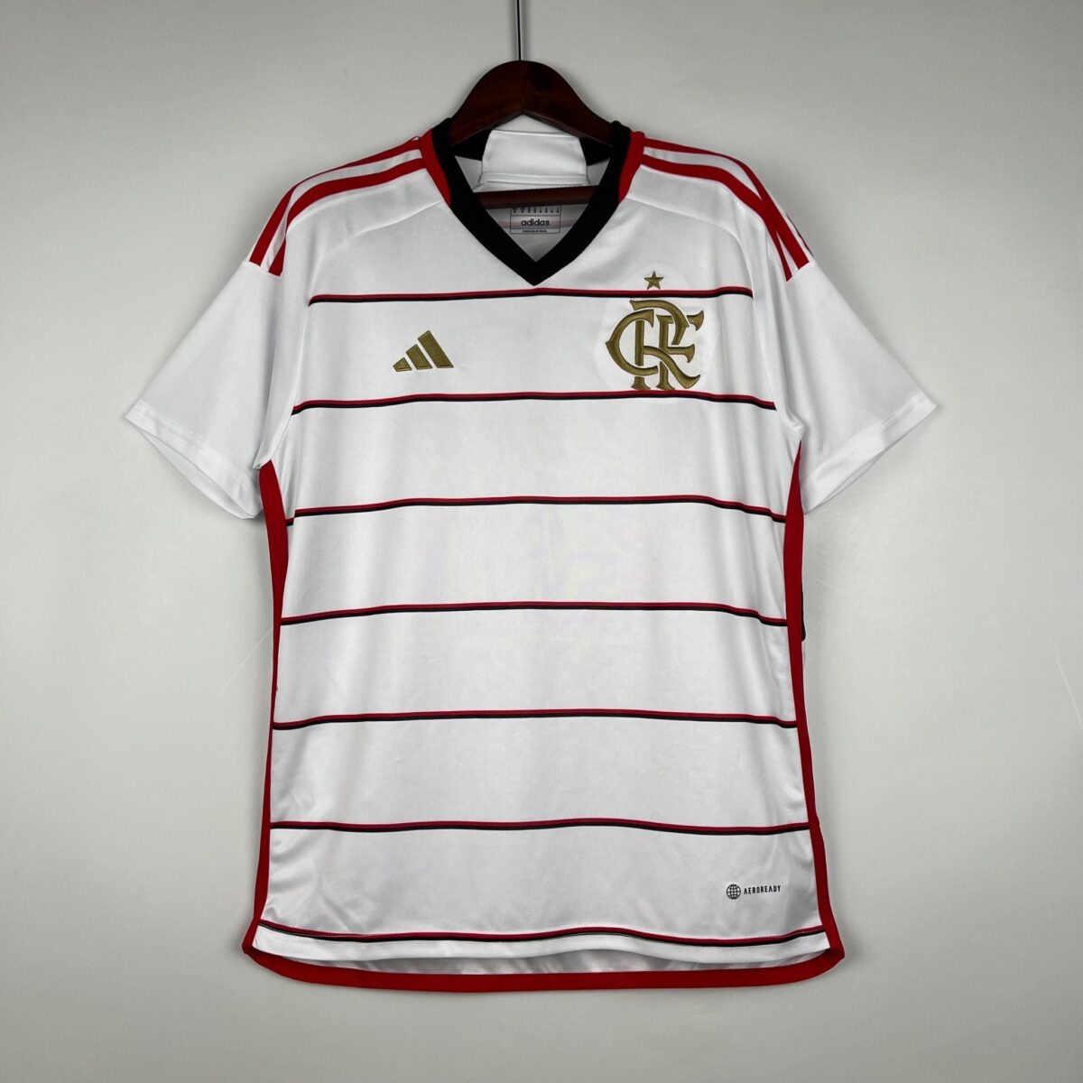 Flamengo football jersey with white and red horizontal stripes, club crest, and Adidas logo.