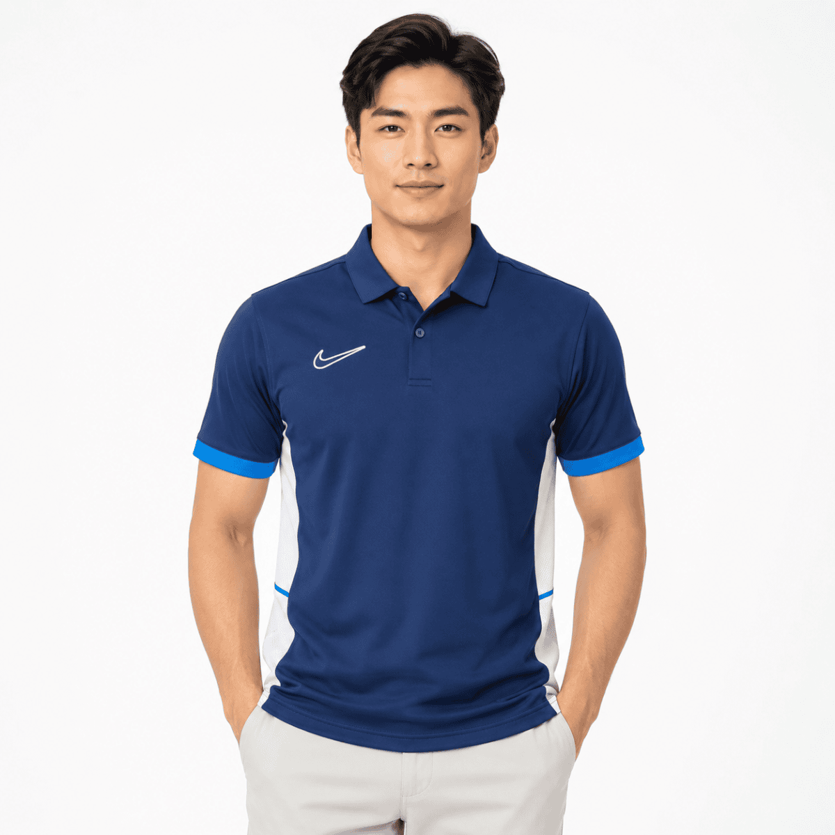 Man wearing a blue Nike training polo shirt with white and light blue accents.