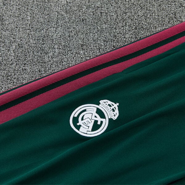Real Madrid green tracksuit joggers 2026/27 club crest and side stripe detail