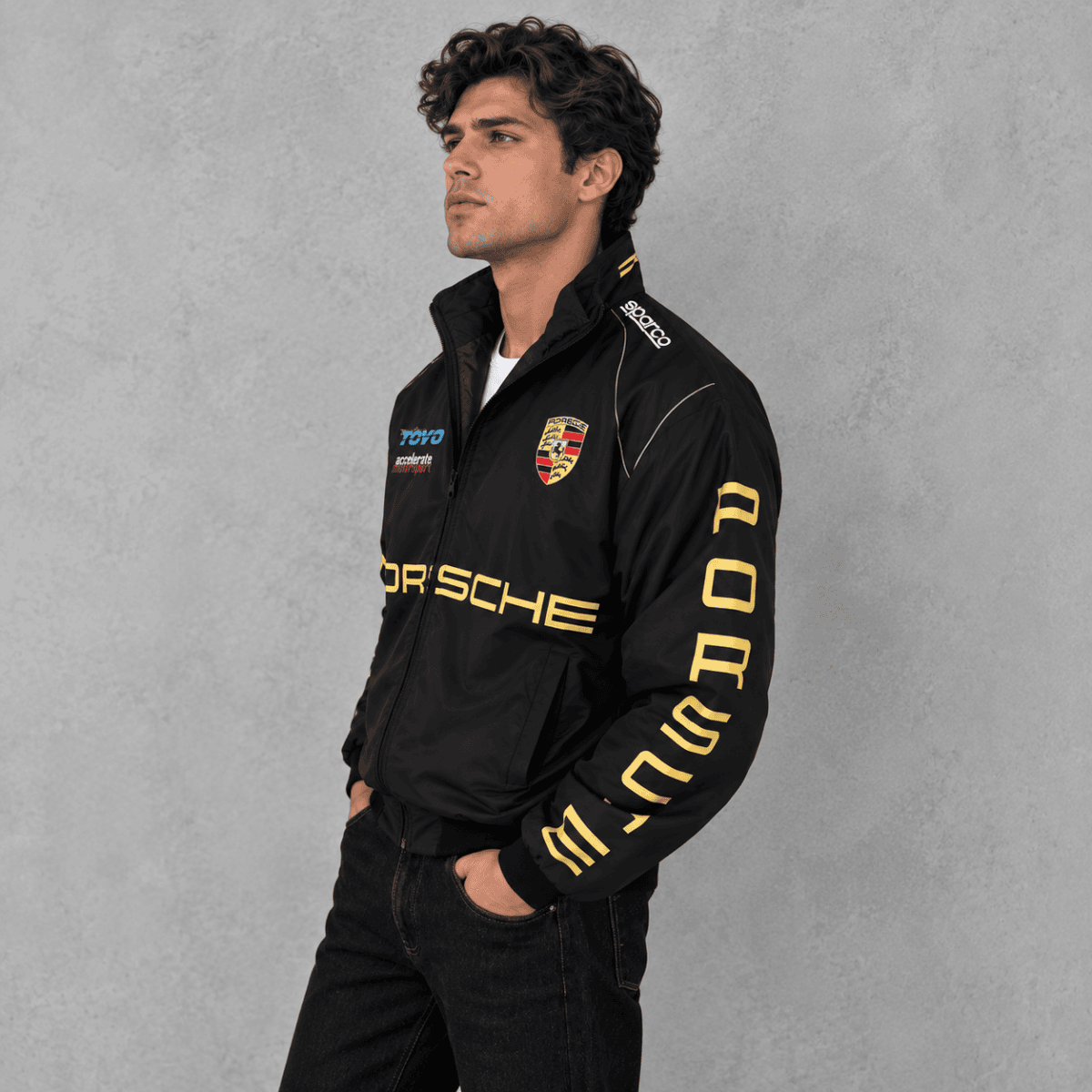 Porsche racing jacket with Porsche logo and sponsor patches, black color.