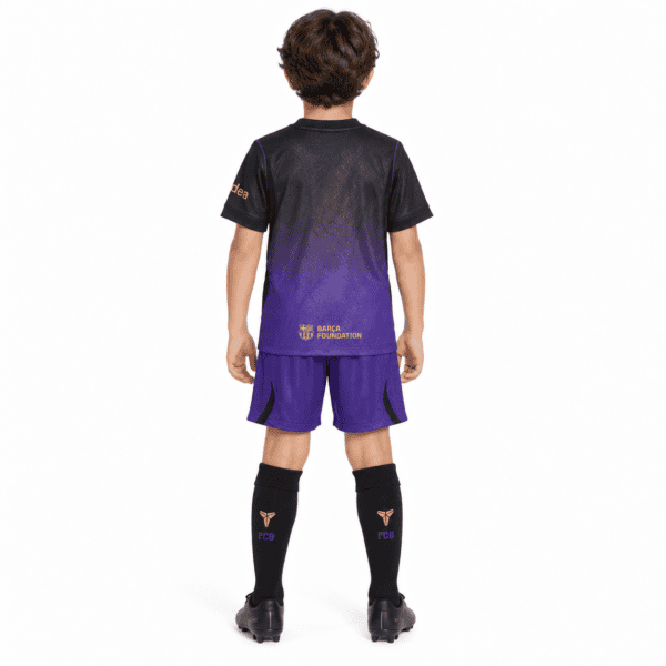Kids Barcelona away kit 2026/27 with black and purple jersey and shorts.