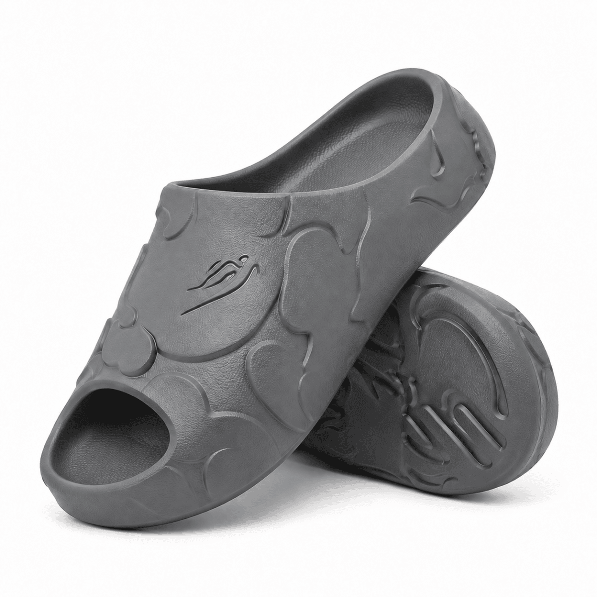 Grey Bape Slides with embossed logo and wave design on the surface.