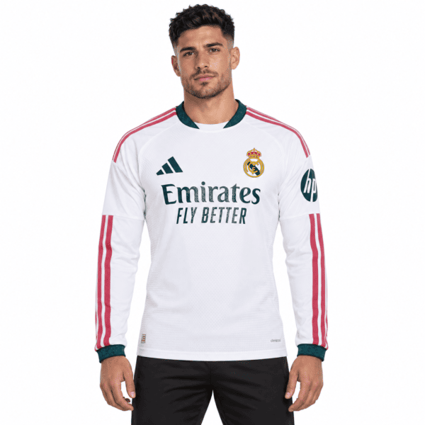 0da07989-6013-4e30-aa66-0cc44b51c9d2 - UAE SPORT STORE Real Madrid home long sleeve jersey 2026/27 with white, green, and pink colors.