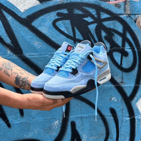 Light blue Air Jordan 4 Retro sneakers with black and white accents.