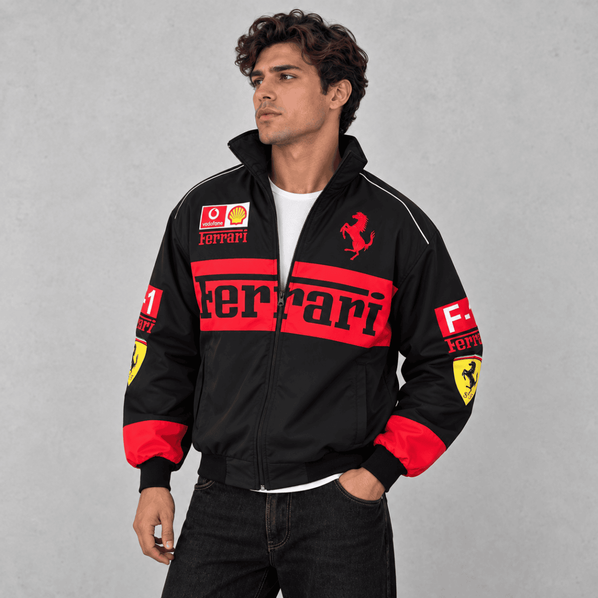 Black Ferrari Formula 1 team jacket with red and yellow logos and accents.
