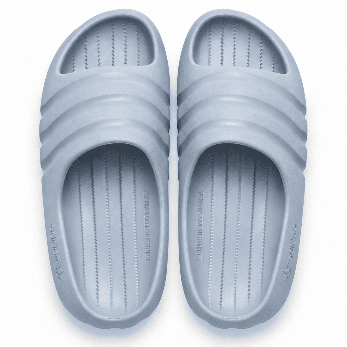 Light blue adidas Adilette Ayoon slides with Bad Bunny branding.