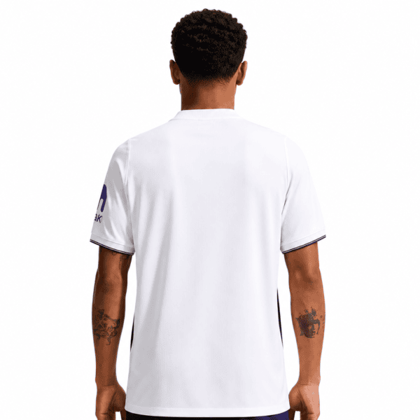 Back view of a white football jersey with blue accents for UAE national team.