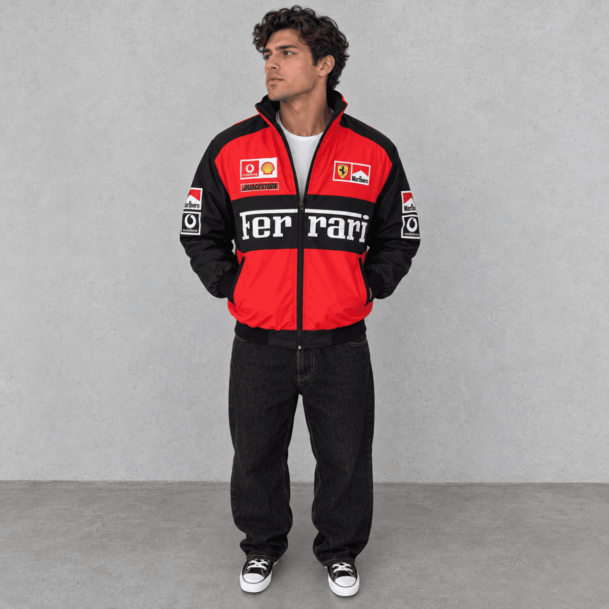 Man wearing Ferrari Formula 1 team jacket with red, black, and white colors.