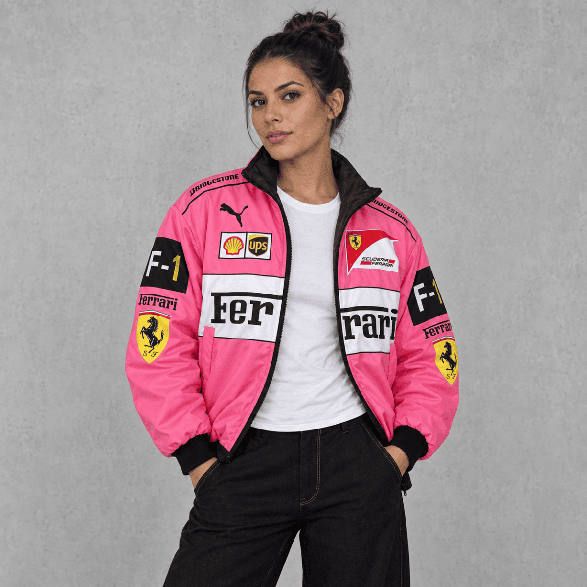 Pink Formula 1 racing jacket with Ferrari and sponsor logos, model wearing casual pose.