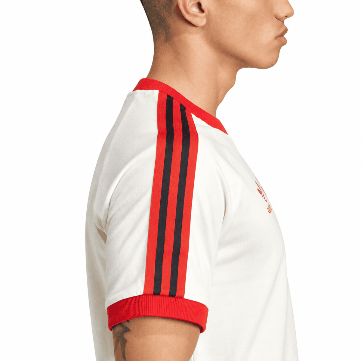 White Flamengo jersey with red and black shoulder stripes and red collar.