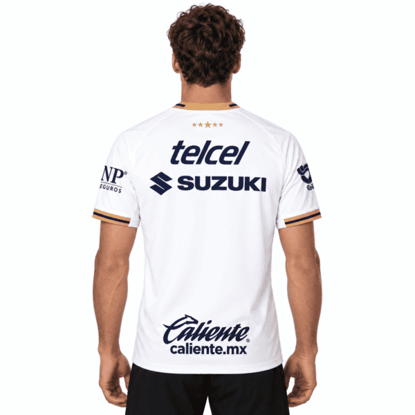 Pumas UNAM away football jersey with sponsor logos, back view, white with black and gold accents.